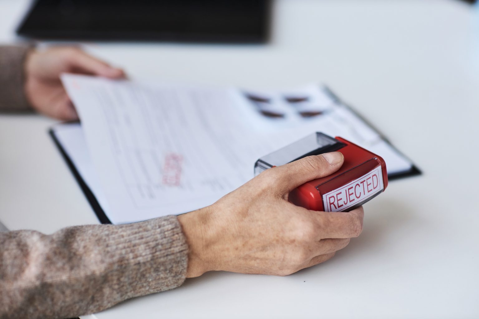  Focus On Hand Of Mature Female Manager Holding Red 